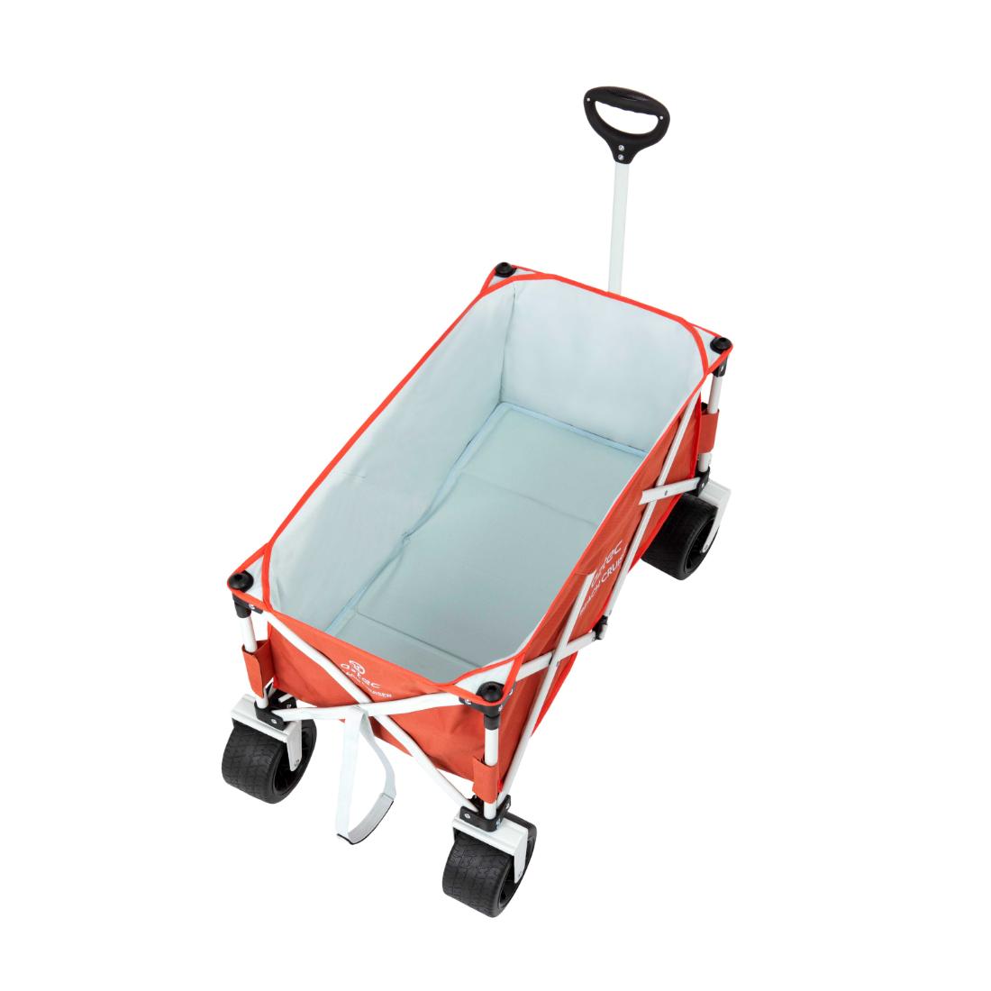 עגלת החוף Aztec Beach Cruiser היא עגלה מתקפלת בצבע אדום, עם ידית שחורה, שלדה לבנה וארבעה גלגלים שחורים גדולים — אידיאלית להובלת ציוד החוף שלכם אל החוף.