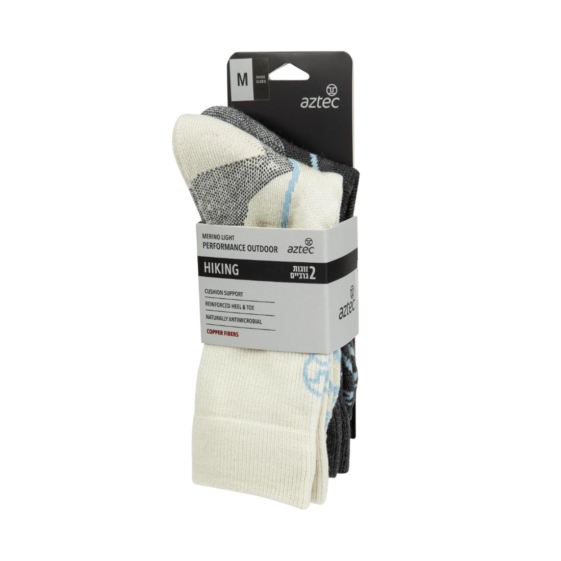מארז של שני זוגות גרבי טיולים Aztec Merino Light II (מידה בינונית) כולל זוג אחד לבן וזוג אחד אפור כהה, העשויים מצמר מרינו. על האריזה מפורטים המאפיינים ופרטי המוצר.