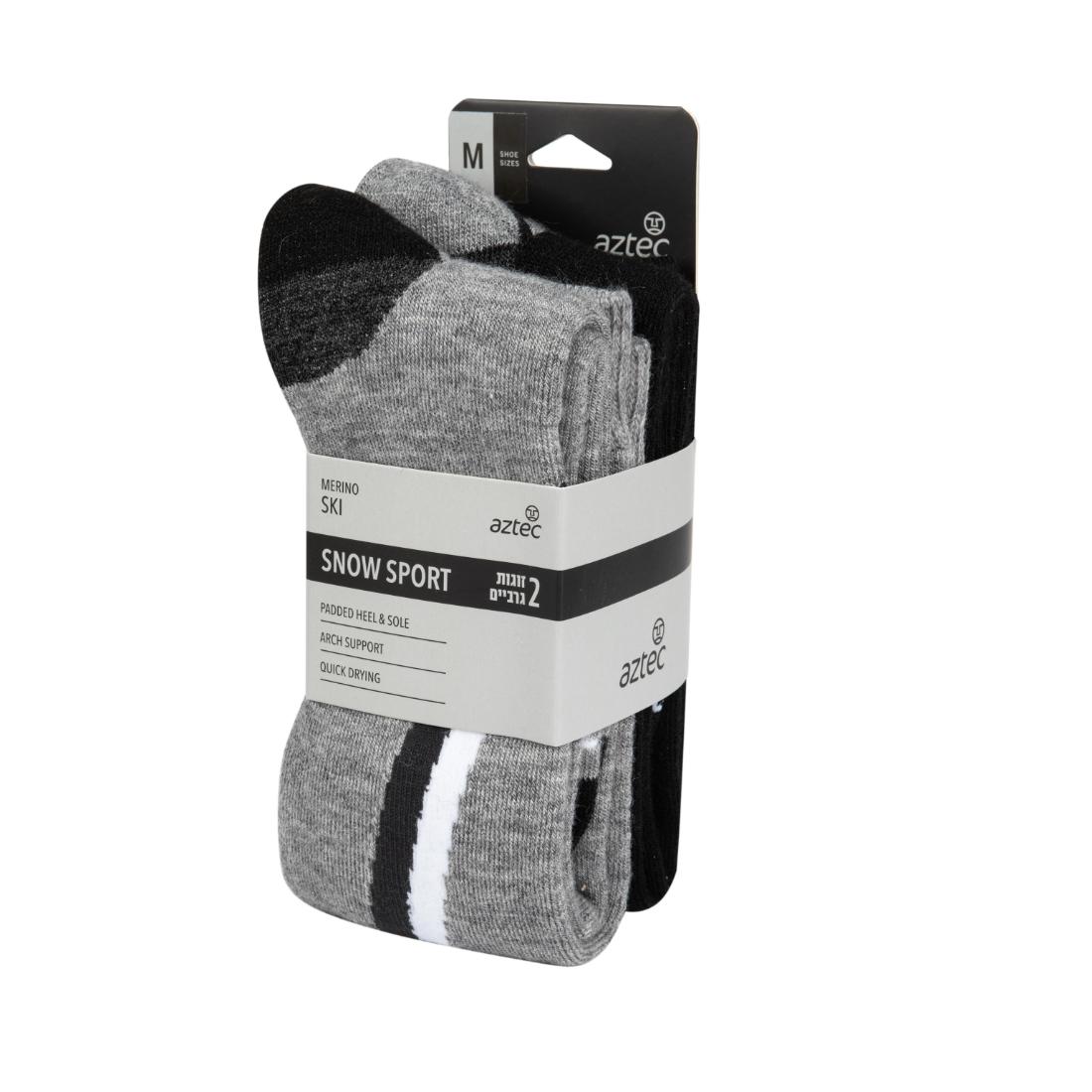 שדרגו את ציוד הסקי שלכם עם גרבי Aztec Merino Ski II — בצבעים אפור ושחור, במידה בינונית, הכוללים תמיכה בקשת כף הרגל וריפוד. האריזה כוללת תווית לבנה ושחורה המדגישה את התכונות העיקריות הללו.