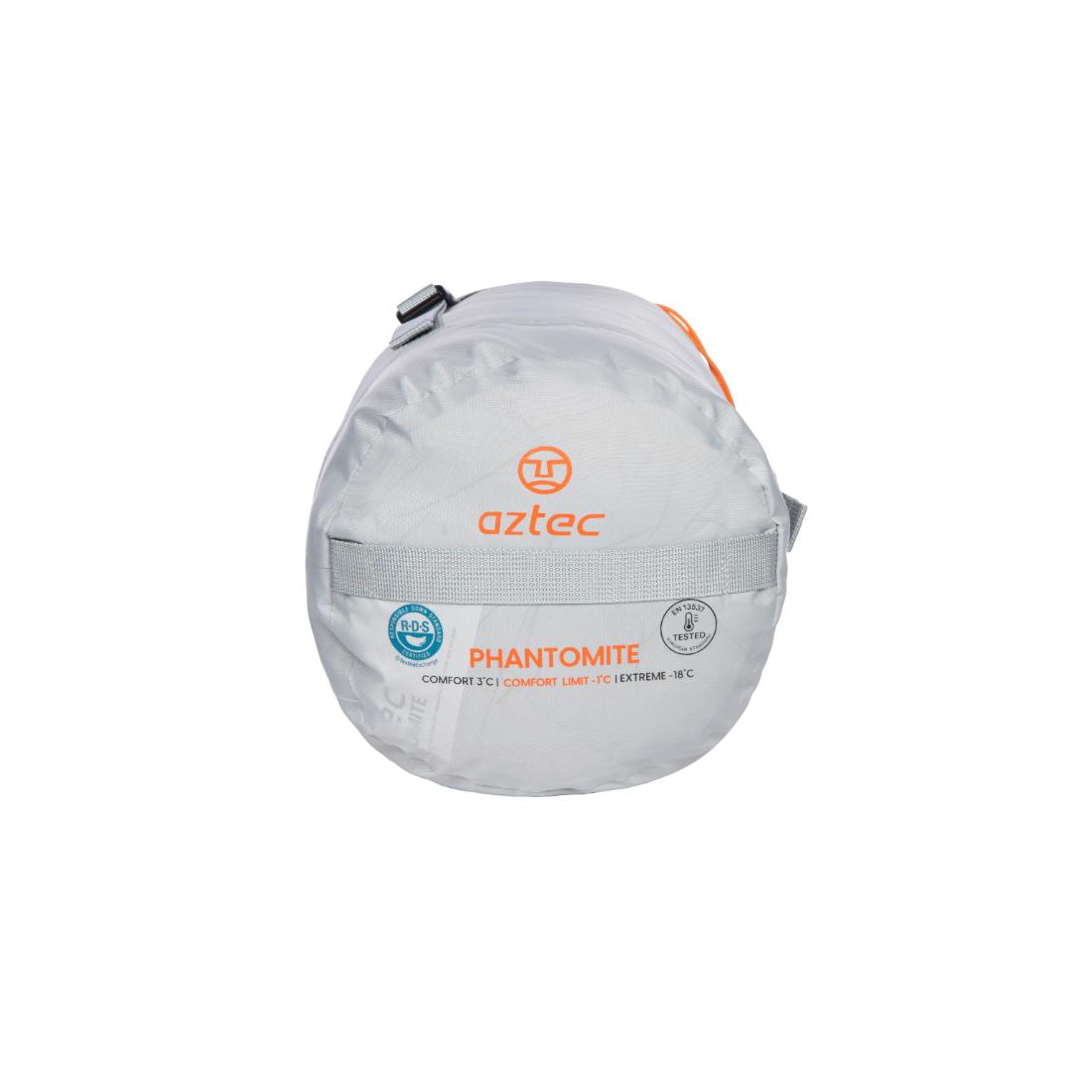 שק שינה קומפקטי, גלילי, בצבע אפור, מדגם Aztec Phantomite -1, עם דירוג נוחות בחזיתו וידית כתומה בחלקו העליון.